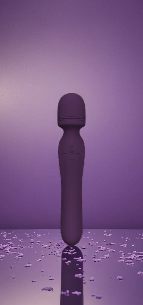 The Erotx Swerve wand in purple, photographed among lavender